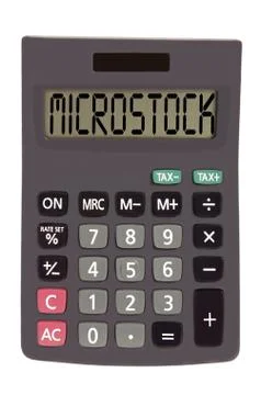 Old calculator on white background showing text "microstock" Illustrazione stock