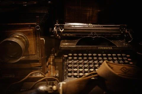 Old camera and typewriter on a table Stock Photos