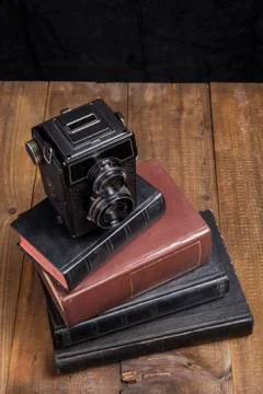 Old Camera On Books Stock Photos