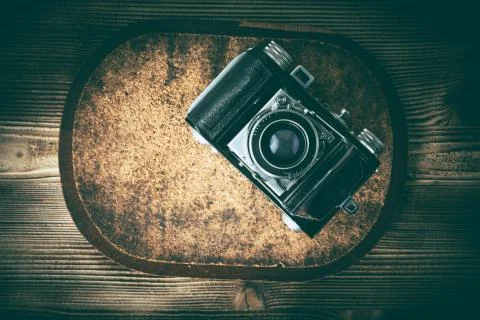 An old camera on a cork pad. Stock Photos