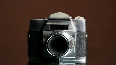 Old camera on dark background Stock Photos