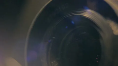 Old camera in the dark retro style lens light studio dust indoor Stock Footage 64856887