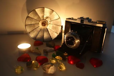 Old camera with flash and decor Stock Photos