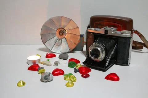 Old camera with flash and decorations Stock Photos