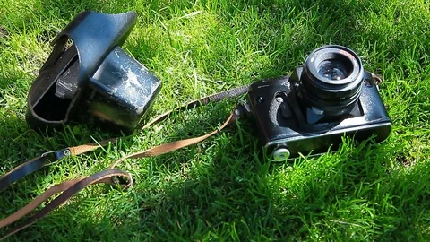 Old camera green grass tree shadow background nobody hd footage Stock Footage 110843896