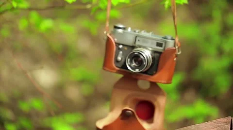 Old camera hanging on the tree Stock Footage 64181804
