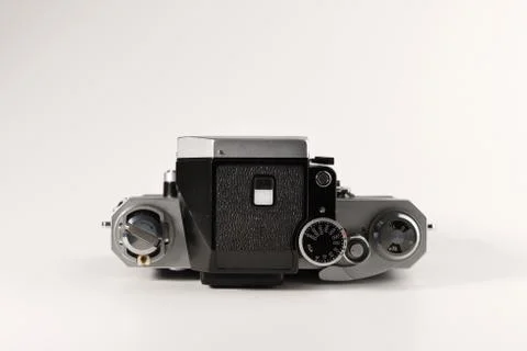An old camera is isolated on a white background Stock Photos
