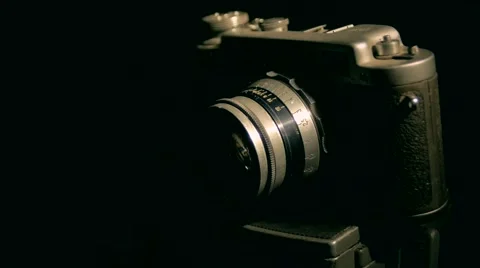 Old camera with the light retro style studio dark light Stock Footage 64856074
