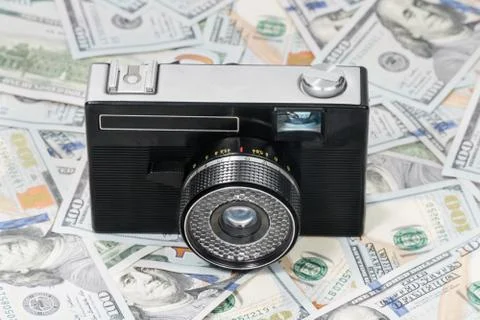 Old camera on money Stock Photos