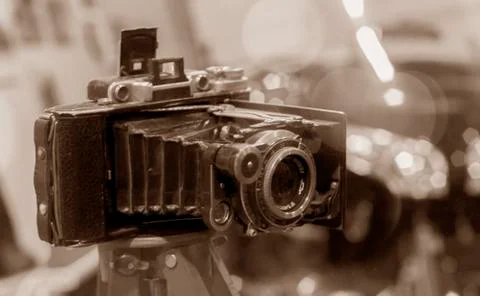 Old camera on a tripod Stock Photos