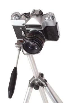 Old camera on a tripod Stock Photos