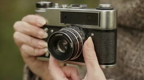 Old camera in the women's hands Stock Footage 12725098