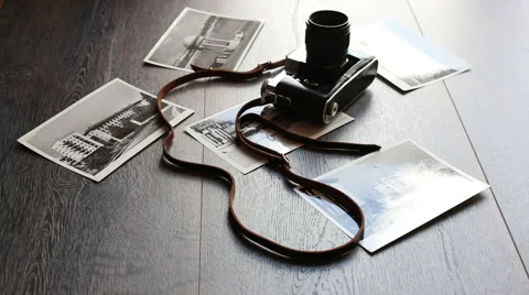 Old camera on a wooden table Видео 59697082