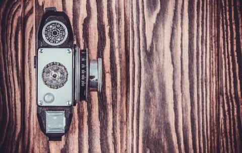 Old camera on wooden table Stock Photos