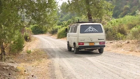 Old Camper Van On a Jungle Road for camping Stock Footage 155590481