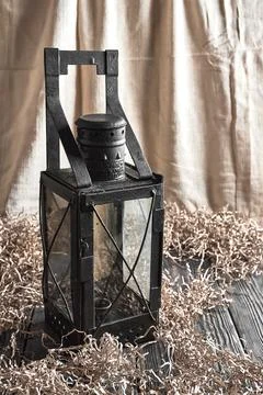 Old candle lantern in the interior Stock Photos