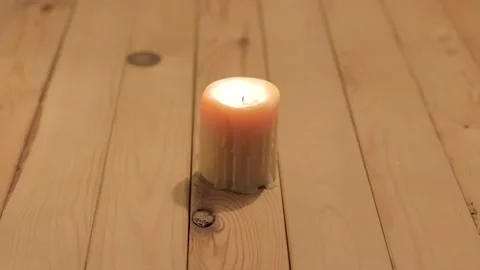 Old candle on a wooden table Stock Footage 340960002