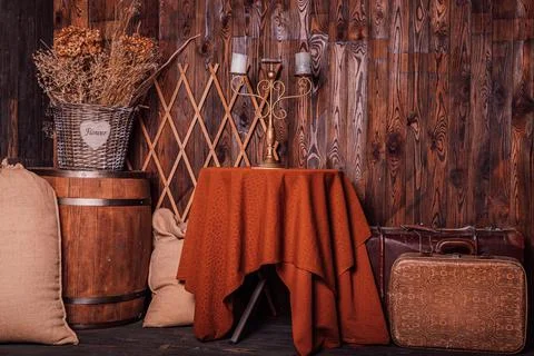 An old candlestick with candles on the table. Loft style in brown tones Stock Photos
