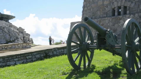 Old cannon situated by monument Stock Footage 96164700