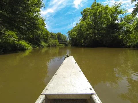 Old canoe down the river. Stock Photos
