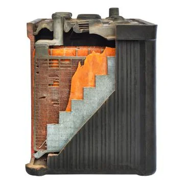 Old car battery with partly opened casing isolated on white 库存照片