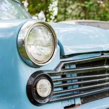 Old car with close-up on headlights Foto stock