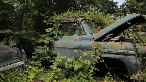 Old car decaying in junkyard Stock Footage 91235006
