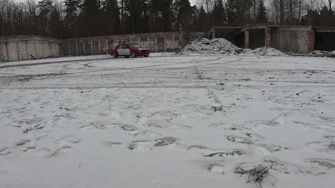 An old car drifts along a snowy road. Winter. A lot of snow. Stock Footage 130741953