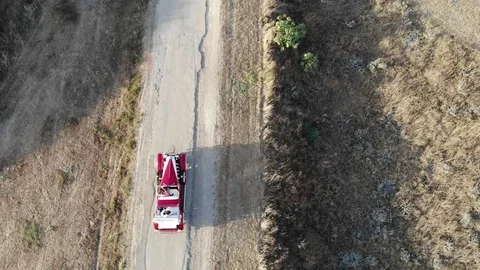 Old Car Driving Along Empty Country Road At Golden Summer Sunset Stock Footage 106579549