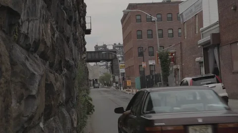 Old Car Driving By Stone Wall Stock-Footage 100901173