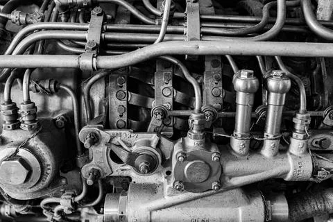 Old car engine fuel delivery system with pressure lines and regulators Stock Photos