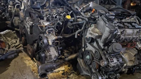 Old Car Engine in the Repair Shop Footage. Auto parts pile of old car at garage Stock Footage 265586761