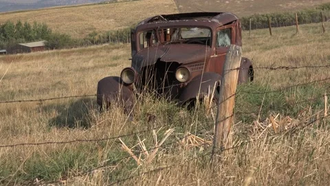 An old car in a field. 4K Stock Footage 163614723