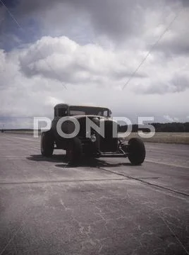 An Old Car On A Race Track