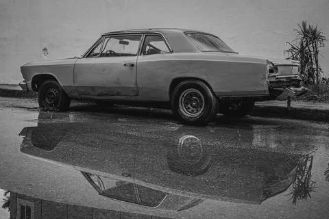 Old car with reflection in water Stock Photos