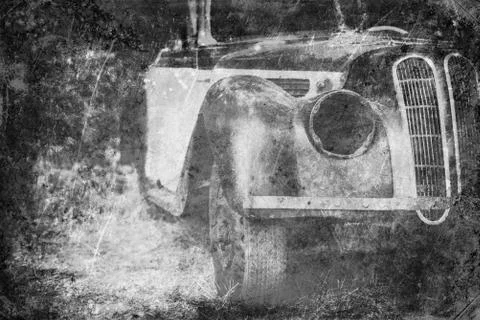 Old Car rusting in forest, black and white vintage photo effect Fotos Stock