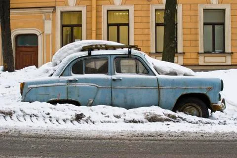 Old car in a snowdrift Stock Photos