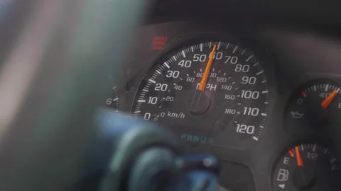 Old car speedometer going over 60 mph. Closeup handheld shot of Stock Footage 272435289