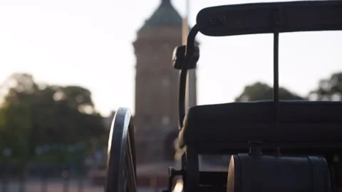 Old car with three wheels, Old Water Tower in City Stock Footage 159888881