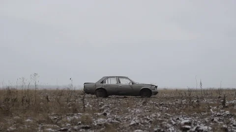 Old car thrown into the field, Side View Stock Footage 101529415
