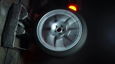 Old car wheels titanium rims long exposure video Stock Footage 305654612