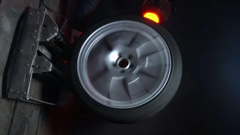 Old car wheels titanium rims long exposure video Stock Footage 305654620