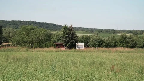 Old caravan as a permanent camper in a field Stock Footage 141468410