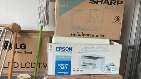 Old cardboard boxes of microwave, tv and printer at home storage, Thailand Video stock 245706913