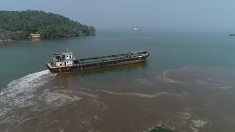 The old cargo ship makes a maneuver to change course. Shooting with a drone. Stock Footage 85651527