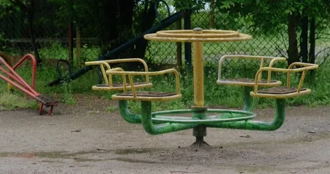 An old carousel on an abandoned playground Stock Footage 190962740