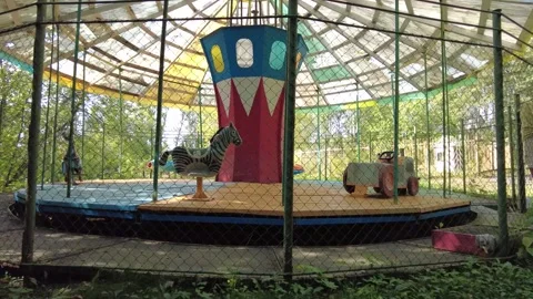 Old carousel behind the fence 2 動画素材 159724745