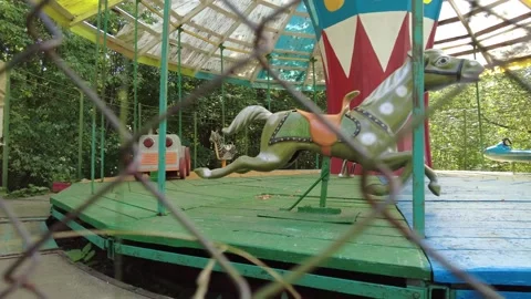 Old carousel behind the fence 動画素材 159725699