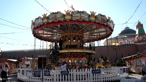 An old carousel on Red Square near GUM. People walking, having fun Stock Footage 186371082