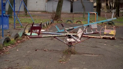An old carousel rotates in the playground Video stock 145484301